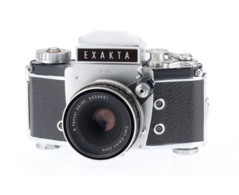 An Exakta Varex IIb 35mm SLR Camera, silver, body VG, advance lever gets stuck at "fully advanced" intermiitently, shutter fi