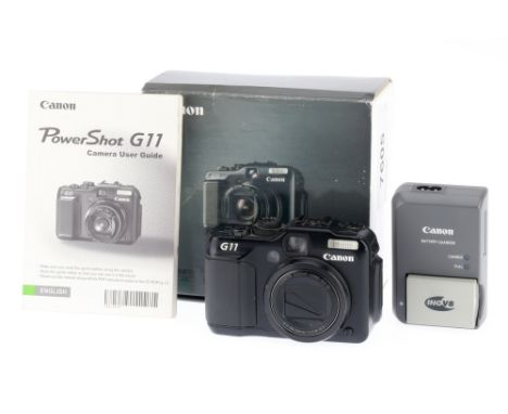 A Canon Powershot G11 Digital Compact Camera, black, body G, a few small marks to LCD, powers up, takes a picture, flash work