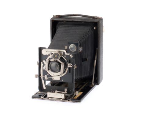 A Busch Doppel Liliput Half Plate Folding Camera, black, body G, double extension bellows open and fold correctly, lens is an