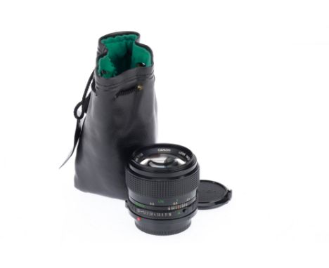 A Canon FD f/1.2 50mm Lens, black, serial number 17788, barrel VG, optics G with very light haze and dust, with caps and soft