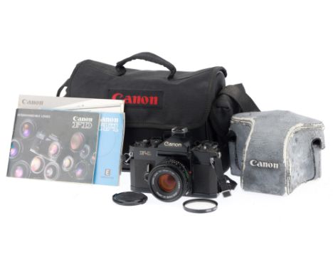 A Canon F-1 35mm SLR Camera, black, serial number 594446, body VG, shutter works, self-timer works, viewfinder has dust spots