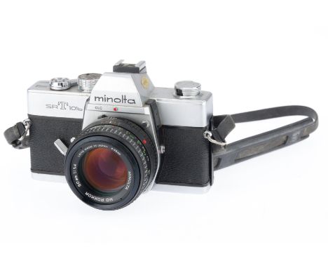 A Minolta SRT101b 35mm SLR Camera, silver, serial number 4466939, body F-G, shutter jammed, self timer works, with a MD Rokko