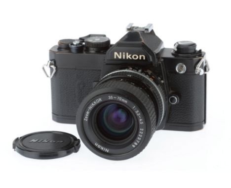 A Nikon FM 35mm SLR Camera, black, serial number 3313909, body G, brassing to black metal parts, shutter works, self timer wo