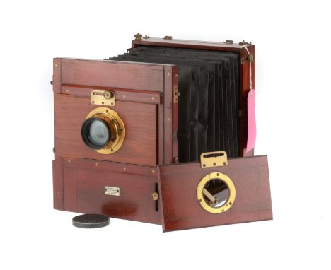A Watson Full Plate Tailboard Camera, mahogany and brass construction, body G, focussing screen intact, opens and closes corr