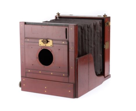 A Watson Full Plate Tailboard Camera, English, c. 1900, mahogany and brass construction, focussing screen present, with lens 