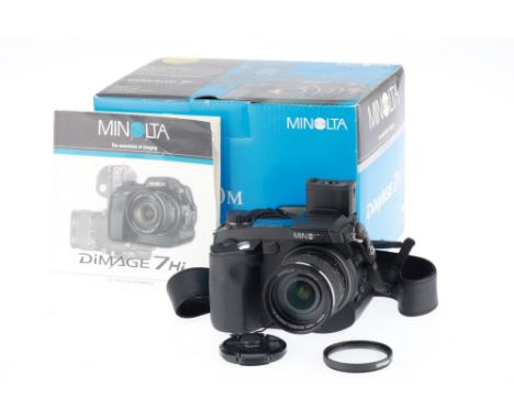 A Minolta Dimage 7 Hi Digital Camera, black, body F-G, evidence of battery leakage, does not power up, in maker's box with ma
