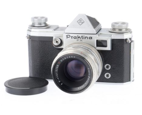 A KW Praktina FX 35mm SLR Camera silver, shutter cocks but does not close after firing, body G, black marks in viewfinder, wi