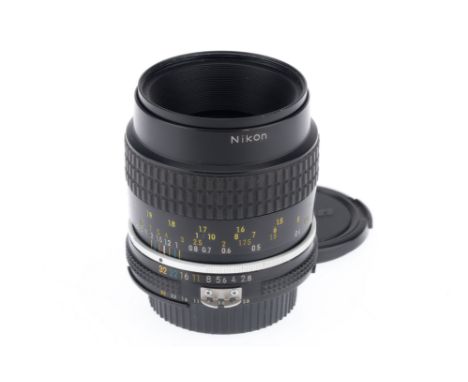 A Nikon Micro-Nikkor f/2.8 55mm Ais Lens, black, barrel G, serial number 203173, optics G, light dust, with caps.