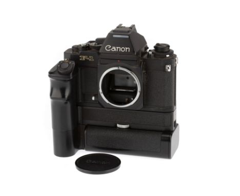 A Canon New F1 35mm SLR Camera Body, black, serial number 173662, body G, black bottom plate, minor marks to prism cover, shu