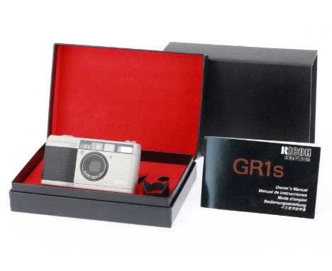 A Ricoh GR1s Compact 35mm Camera, grey, serial number JW146108, body VG, with batteries inserted shutter works, flash works, 