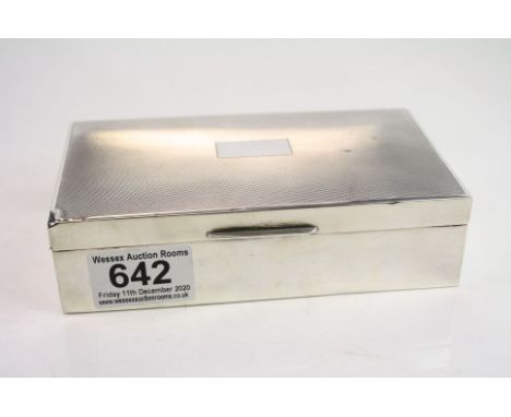 Silver cigarette box, blank rectangular cartouche to centre, engine turned decoration, makers E &amp; N Speak, Birmingham 196