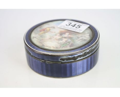 French painted enamelled silver lidded trinket box of circular form, the idyllic courtly scene with ladies, musician and ston