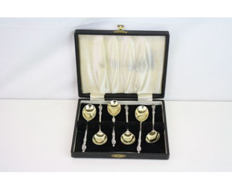 Six Victorian silver gilt Apostle terminal coffee spoons, mask decoration to stem, makers Harrison Brothers &amp; Howson, She