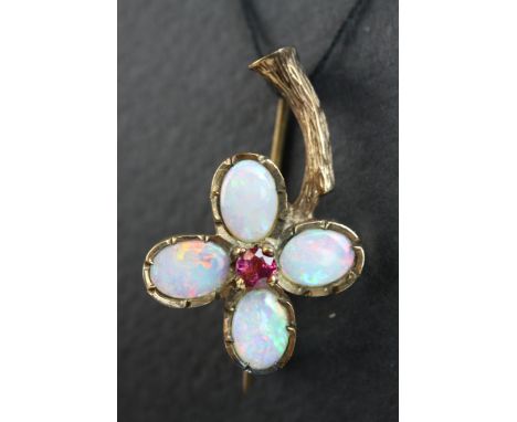 Victorian opal and ruby 9ct rose gold flower head brooch, the flower head formed of four oval cabcohon cut precious white opa