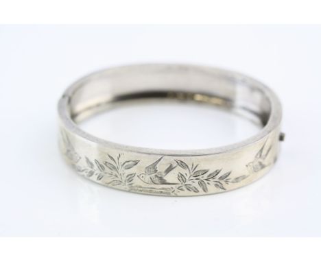 Silver hinged bangle, bright cut swallow and foliate decoration, tongue and box clasp, width approx 12mm 