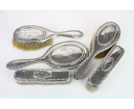 Edwardian five piece silver dressing table brush set comprising two hair brushes, two clothes brushes and a hand mirror, cast