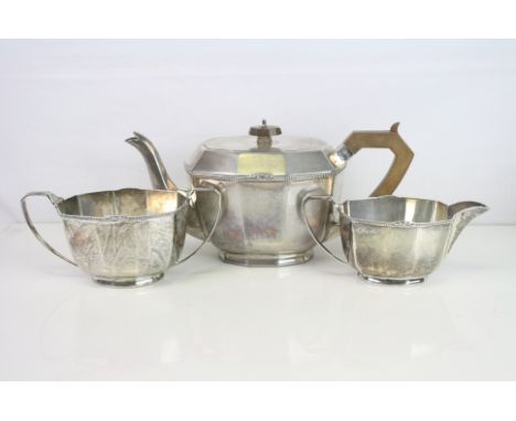 George V Art Deco silver three piece tea service comprising teapot, milk jug and twin handled sugar bowl, the tea post with B