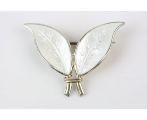 Willy Winnaess for David Andersen: a Norwegian white enamelled silver gilt double leaf brooch, basse-taille enamel, stamped D