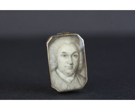 George III mourning brooch depicting a pen and ink portrait of a gentleman, rub over unmarked yellow metal setting, the blood