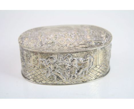 Continental silver oval trinket box, repousse town scene with dancers, lovers and musician to the hinged lid, tavern scene wi