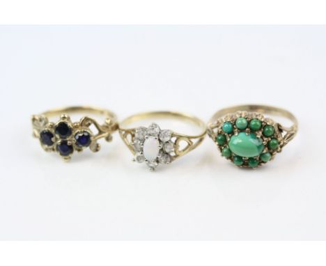 Three rings to include turquoise 9ct yellow gold cluster ring, ring size L, an opal and cubic zirconia 9ct yellow gold cluste