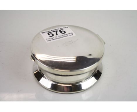 Silver footed circular trinket pot, engraved initials to hinged lid, the lid opening to reveal mirror, weighted base, makers 