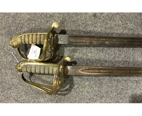 19th century Officers sword, 82cm decorated blade by H. Wilkinson, brass hilt, wire-bound fish skin hilt, and a similar sword