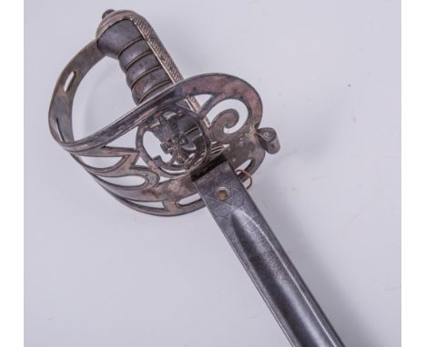 A Victorian Officers sword, 83.5cm decorated blade, indistinctly marked and overstamped W K & C, inset PROVED, light infantry