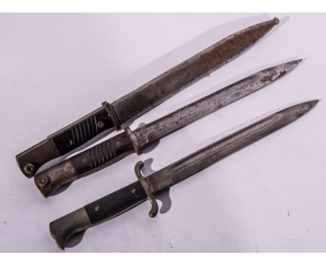 A German M1884/98 bayonet, 25cm blade stamped GEBR.HELLER, associated scabbard, another similar, no scabbard, and another Ger