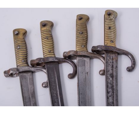 A French 1866 Chassepot bayonet, Chatellerault September 1868, 57.5cm blade, no scabbard, and three other Chassepot bayonets 