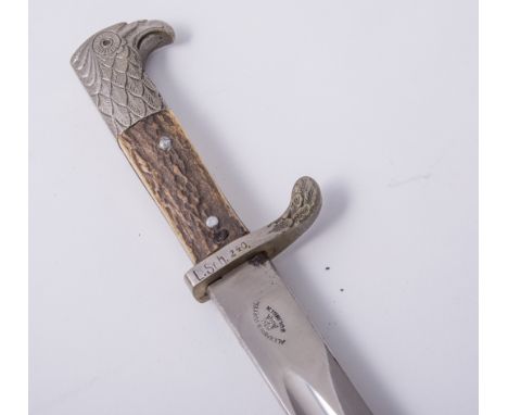 A German Third Reich Police bayonet, 33cm blade marked Alexander Coppel Solingen and with AC above scales, horn two part grip