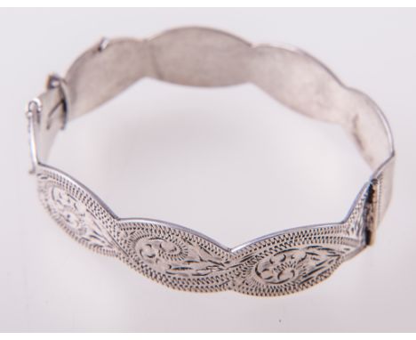 A silver solid double curb link bracelet, four charms attached, hallmarked London 1974, approximate weight 1.75oz, a white me