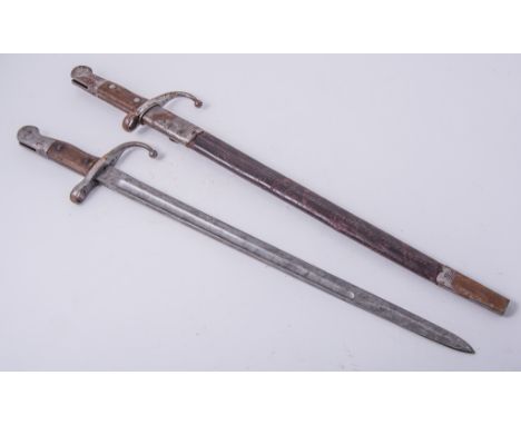 An Enfield pattern Turkish bayonet, the blade engraved and stamped with star and crescent, 46cm blade, with scabbard, and ano