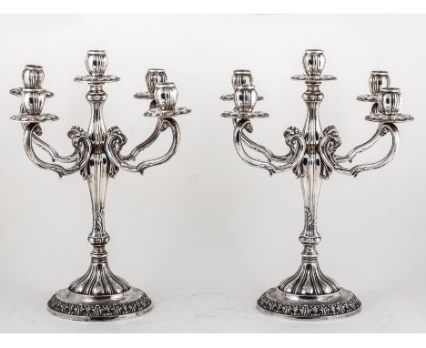Pair of sterling silver five-light candelabra, probably Maltese, 20th Century, four scrolled branches, lobed and leaf-capped 