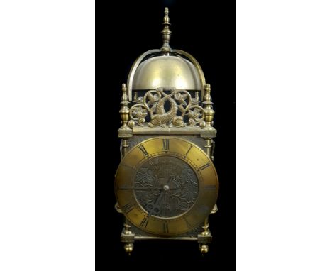 A reproduction brass lantern clock, the dial marked William Sellwood at Ye Mermaid in Lothbury, surmounted by a pierced entwi