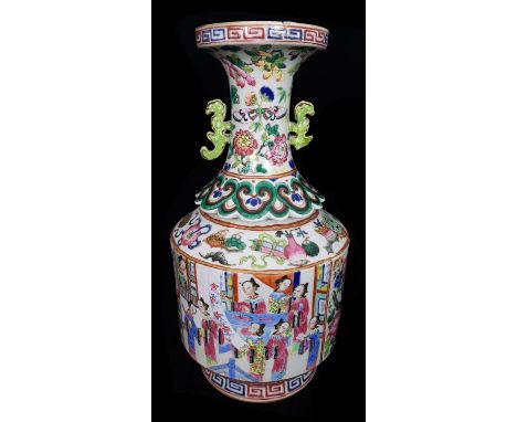 An unusual Chinese famille rose bottle form vase, the trumpet neck with pierced scroll handles and a raised and shaped pelmet