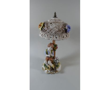 An Italian Ceramic Figural Table Lamp Depicting Boy with Musical Instrument and Dog Begging, 47cm High