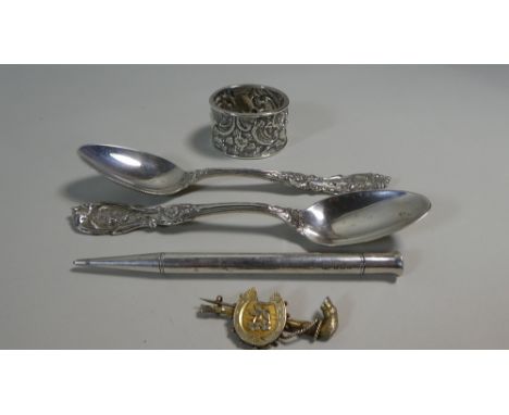 A Collection of Silver Items to Include Two Teaspoons, Napkin Ring, Mascot Propelling Pencil etc