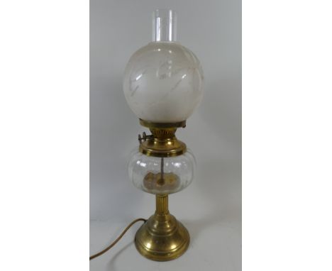 A Brass and Glass Table Lamp in the Form of a Victorian Oil Lamp with Glass Reservoir, Etched Glass Shade and Chimney 