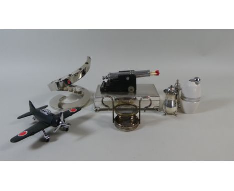 A Tray Containing Silver Plated Cigarette Box, Cannon Match Dispenser, Silver Salt and Pepper Pots, Wine Strainer and Novelty