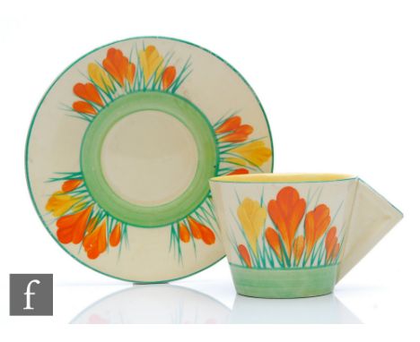 Clarice Cliff - Sungleam - A conical cup and saucer circa 1936, hand painted with Crocus sprays in orange and yellow with yel