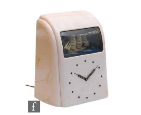 Vitascope Industries Ltd - A pale pink bakelite clock with three masted sailing ship automaton above circular dial, height 31