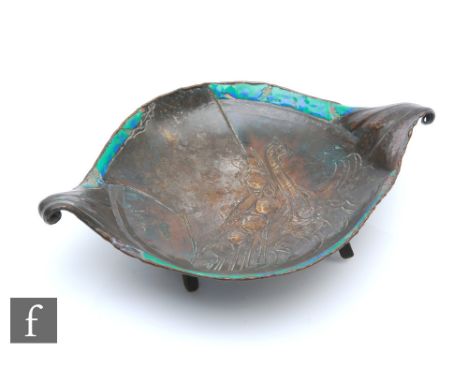 Loys Lucha of Paris - A patinated metal and enamel trinket dish, circa 1910-30, raised on tripod supports, incised with a dep