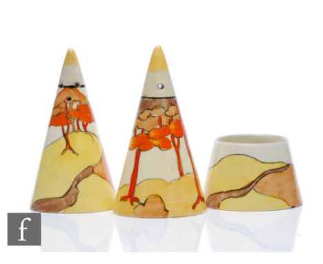 Clarice Cliff - Coral Firs - A conical cruet set circa 1933, hand painted with a stylised tree lined coastal scene with yello
