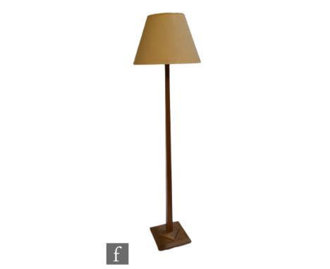 Unknown - A light oak square section standard lamp, raised from a raised square plinth base to a tapered stem, height 155cm. 