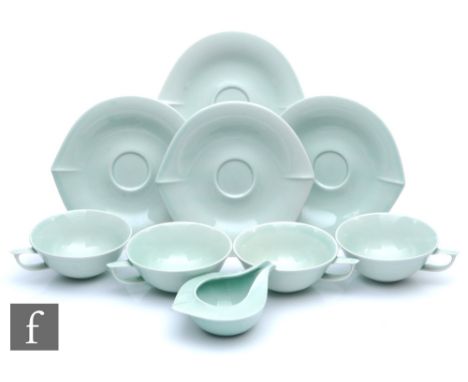 Pentik - A set of four Finnish cups and saucers with a matching stylised milk jug from the Kevat range, each decorated in a p