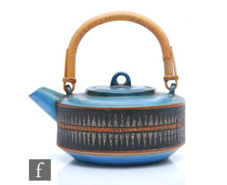 Troika Pottery - A post war teapot / kettle decorated with a band of pattern to the body against a blue wash ground, painted 