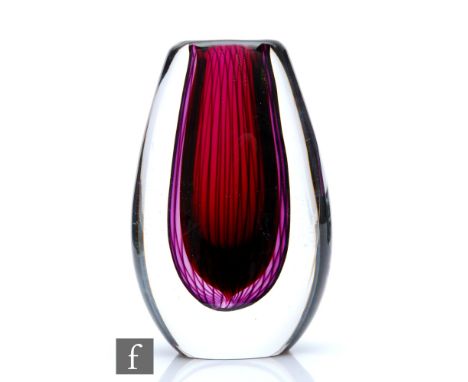 Vicke Lindstrand - Kosta - A post war Unika glass vase of compressed ovoid form, the deep red core cased in amethyst with dee