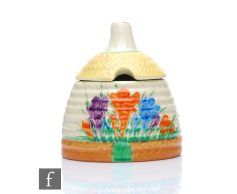 Clarice Cliff - Crocus - A small Bee hive honey pot circa 1937, hand painted with Crocus sprays with orange, green, yellow an