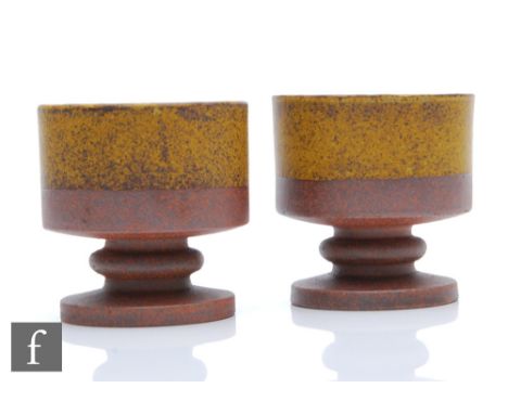 Robin Welch -&nbsp;A pair of stepped candle holders in dipped green glaze over stoneware ground, impressed marks, height 9.5c
